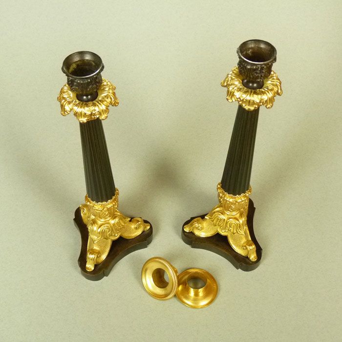 A Pair of Classical French Bronze and Gilt Bronze Candlesticks A Pair of Classical French Bronze and Gilt Bronze Candlesticks