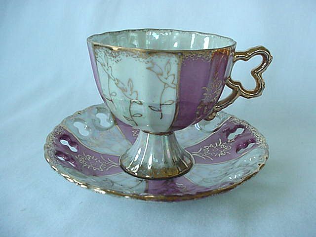 Pedestal Cup And Saucer Gold Trim And Flowered Motif Pedestal Cup And Saucer Gold Trim And Flowered Motif