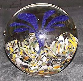 Blue Flower holding an Air Bubble on a Bed of Wavy White,Brown,and Orange Spatter Paperweight ! Blue Flower holding an Air Bubble on a Bed of Wavy White,Brown,and Orange Spatter Paperweight !