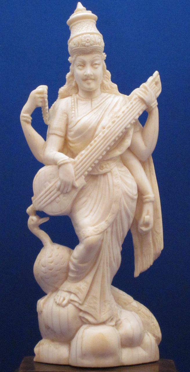Indian Carved Ivory Figure of 4-Armed Saraswati & Peacock, c1900 Indian Carved Ivory Figure of 4-Armed Saraswati & Peacock, c1900
