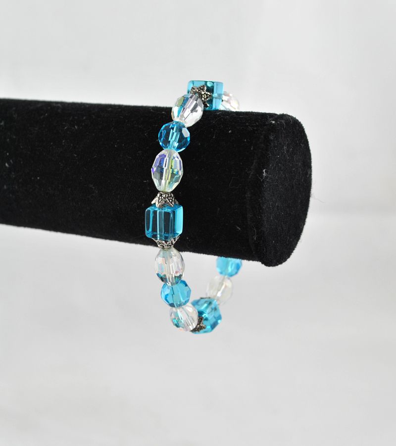 Baby blue Aurora oval shaped crystals joined together with silver spacers 