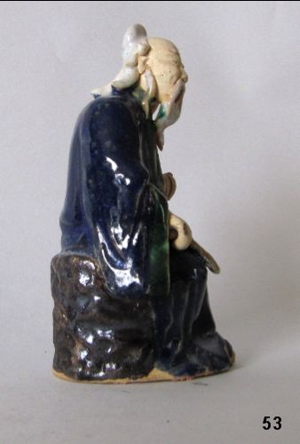 Chinese Mudman Seated Sage With Palm Fan On Textured Rock -Circa 1920 Chinese Mudman Seated Sage With Palm Fan On Textured Rock -Circa 1920