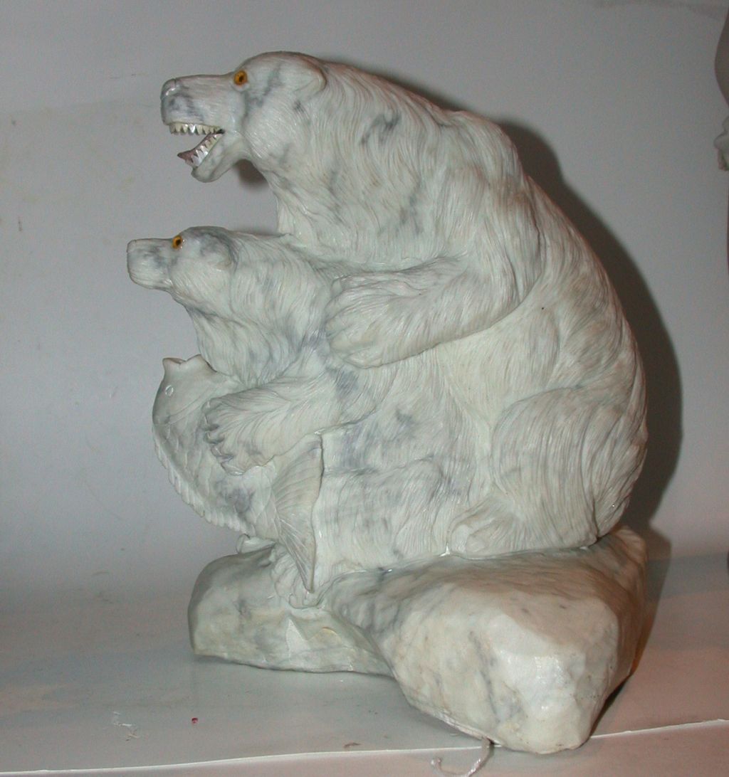 Carved Marble Multi-Figural Group of Two Polar Bears With A Fish, Circa mid 20th Century Carved Marble Multi-Figural Group of Two Polar Bears With A Fish, Circa mid 20th Century