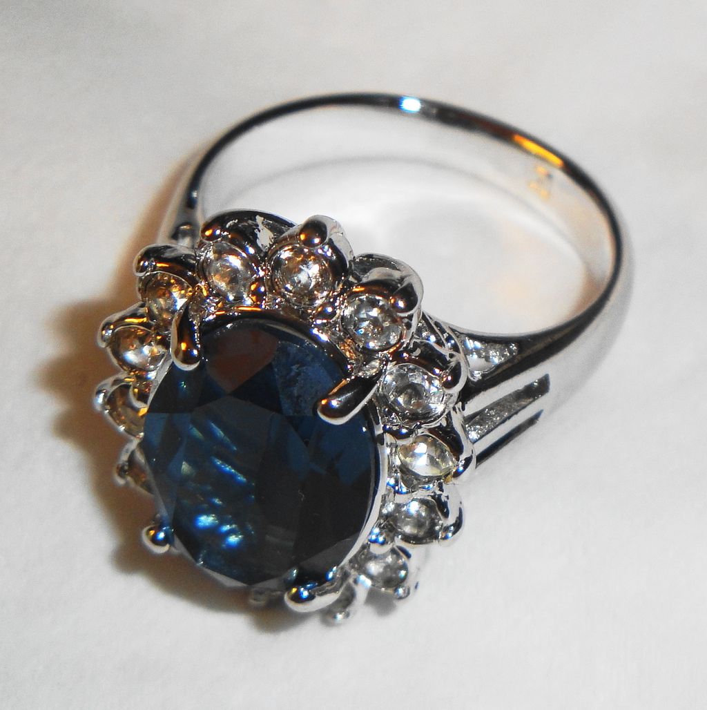 Vintage Avon 1987 "Regal Style Ring" ~ Size 8 ~ faux sapphire surrounded by crystals set in silver-tone Vintage Avon 1987 "Regal Style Ring" ~ Size 8 ~ faux sapphire surrounded by crystals set in silver-tone