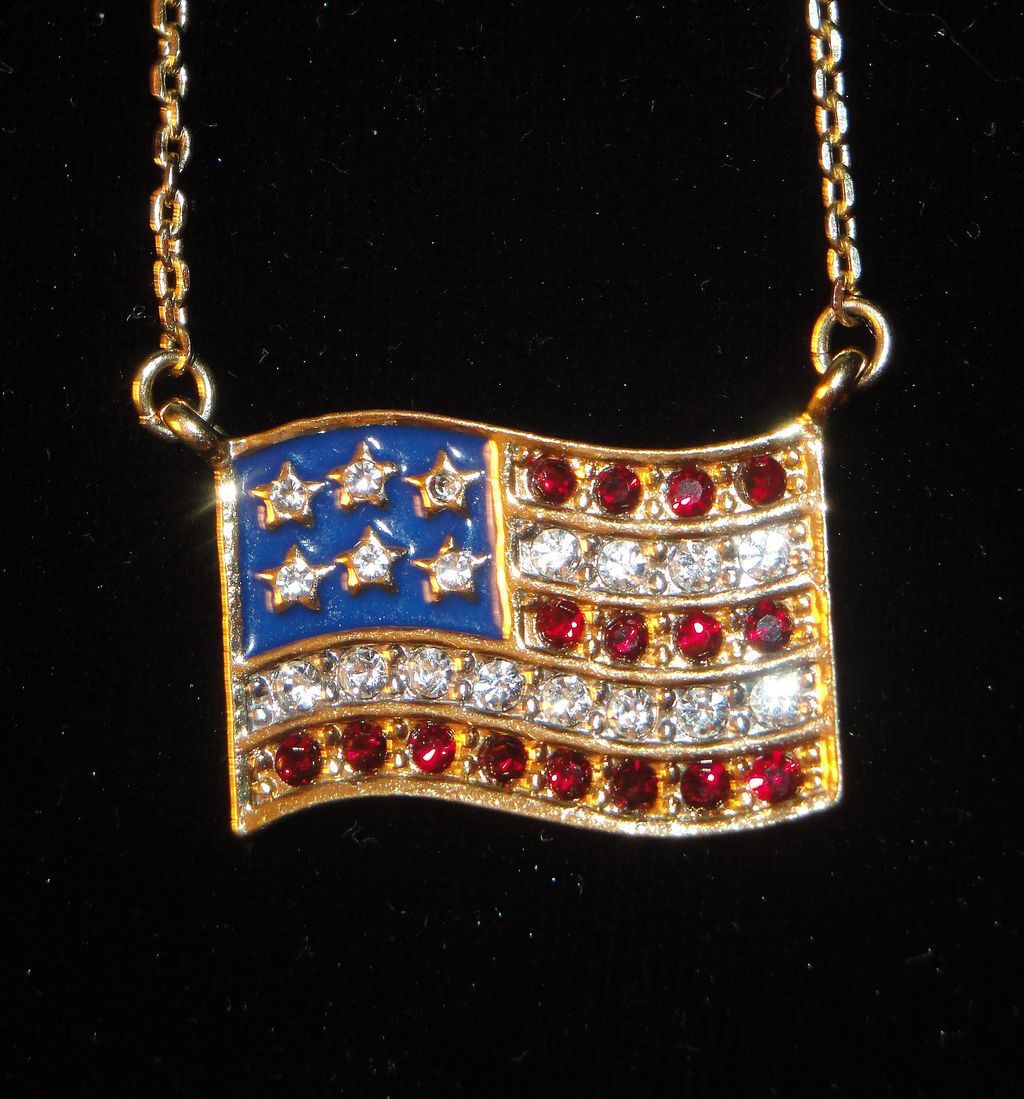 Vintage Signed Avon American Flag ~ gold-tone ~ garnet colored rhinestones for red strips ~ clear rhinestones for stars & white stripes Vintage Signed Avon American Flag ~ gold-tone ~ garnet colored rhinestones for red strips ~ clear rhinestones for stars & white stripes