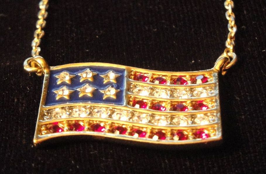 Vintage Signed Avon American Flag ~ gold-tone ~ garnet colored rhinestones for red strips ~ clear rhinestones for stars & white stripes Vintage Signed Avon American Flag ~ gold-tone ~ garnet colored rhinestones for red strips ~ clear rhinestones for stars & white stripes