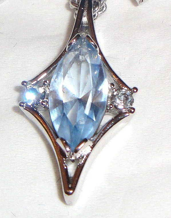 1976 Vintage Signed Avon "Crystal Palace" Collection Necklace ~ large multi-faceted light blue sapphire marquise stone & rhinestones set in silver-tone 1976 Vintage Signed Avon "Crystal Palace" Collection Necklace ~ large multi-faceted light blue sapphire marquise stone & rhinestones set in silver-tone