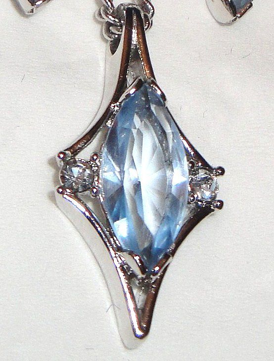 1976 Vintage Signed Avon "Crystal Palace" Collection Necklace ~ large multi-faceted light blue sapphire marquise stone & rhinestones set in silver-tone 1976 Vintage Signed Avon "Crystal Palace" Collection Necklace ~ large multi-faceted light blue sapphire marquise stone & rhinestones set in silver-tone