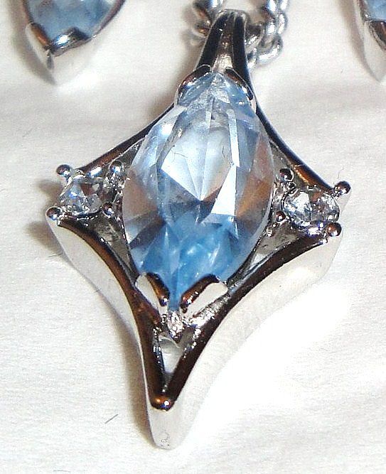 1976 Vintage Signed Avon "Crystal Palace" Collection Necklace ~ large multi-faceted light blue sapphire marquise stone & rhinestones set in silver-tone 1976 Vintage Signed Avon "Crystal Palace" Collection Necklace ~ large multi-faceted light blue sapphire marquise stone & rhinestones set in silver-tone