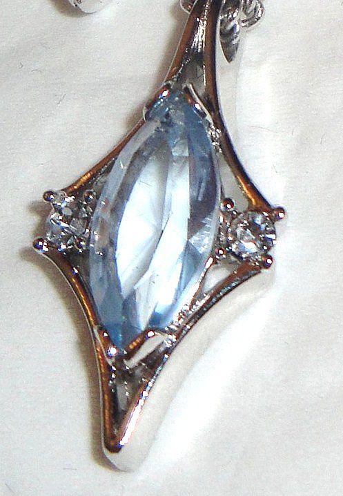 1976 Vintage Signed Avon "Crystal Palace" Collection Necklace ~ large multi-faceted light blue sapphire marquise stone & rhinestones set in silver-tone 1976 Vintage Signed Avon "Crystal Palace" Collection Necklace ~ large multi-faceted light blue sapphire marquise stone & rhinestones set in silver-tone