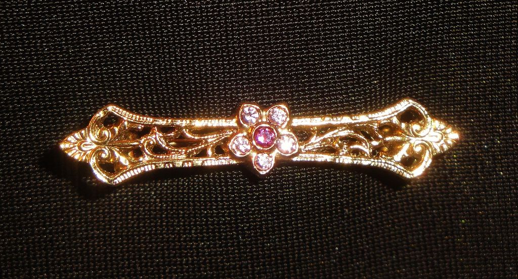 Vintage Elaborately Designed Gold-tone Bar with Flower ~5 faceted small white crystals around an faceted amethyst center Vintage Elaborately Designed Gold-tone Bar with Flower ~5 faceted small white crystals around an faceted amethyst center