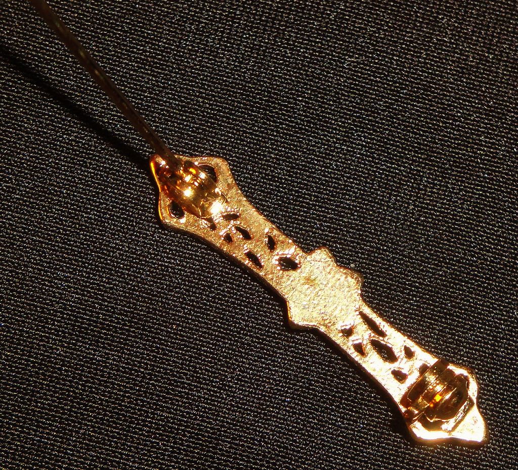 Vintage Elaborately Designed Gold-tone Bar with Flower ~5 faceted small white crystals around an faceted amethyst center Vintage Elaborately Designed Gold-tone Bar with Flower ~5 faceted small white crystals around an faceted amethyst center
