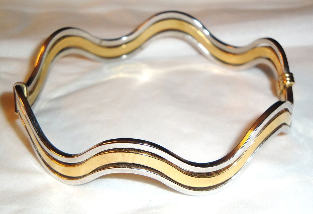 Vintage Signed Avon "Fashion Waves" Bracelet ~ 2 silver-tone bands bordering a band of gold-tone creating an interlocking scalloped bangle Vintage Signed Avon "Fashion Waves" Bracelet ~ 2 silver-tone bands bordering a band of gold-tone creating an interlocking scalloped bangle