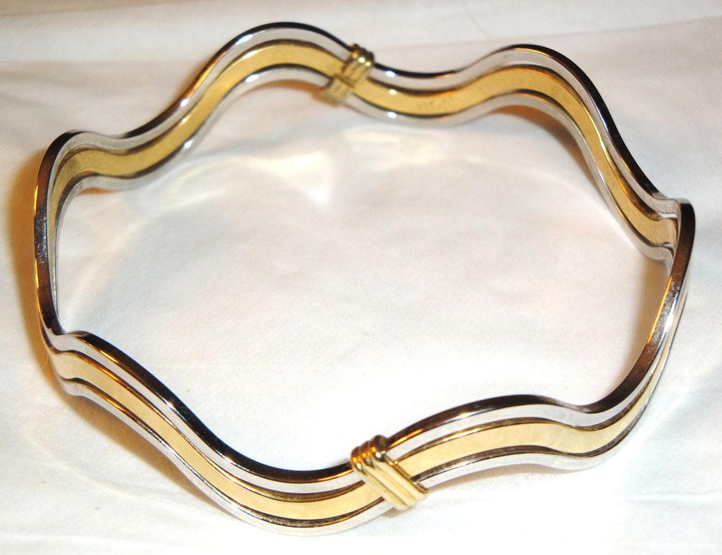 Vintage Signed Avon "Fashion Waves" Bracelet ~ 2 silver-tone bands bordering a band of gold-tone creating an interlocking scalloped bangle Vintage Signed Avon "Fashion Waves" Bracelet ~ 2 silver-tone bands bordering a band of gold-tone creating an interlocking scalloped bangle