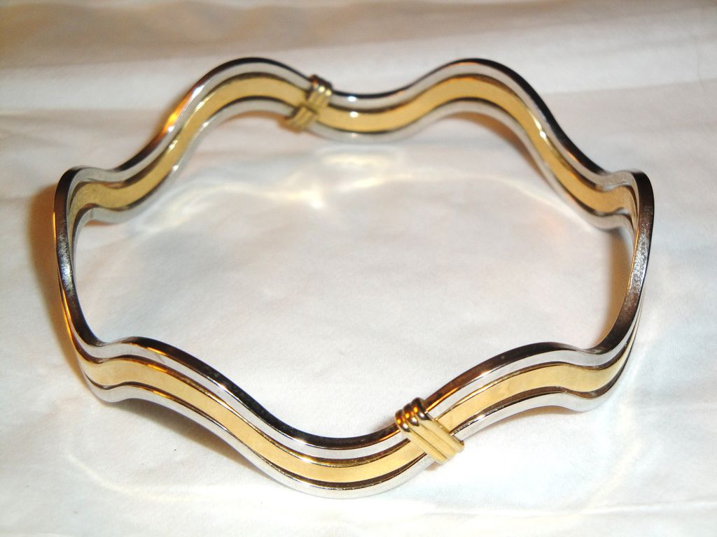 Vintage Signed Avon "Fashion Waves" Bracelet ~ 2 silver-tone bands bordering a band of gold-tone creating an interlocking scalloped bangle Vintage Signed Avon "Fashion Waves" Bracelet ~ 2 silver-tone bands bordering a band of gold-tone creating an interlocking scalloped bangle