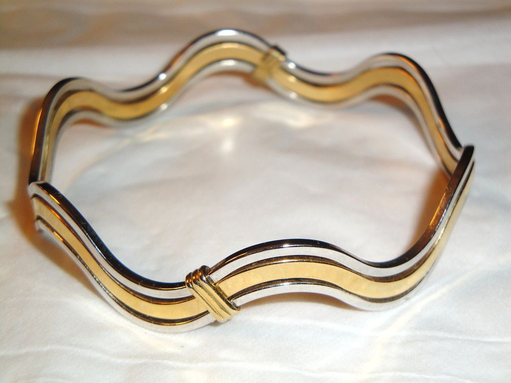 Vintage Signed Avon "Fashion Waves" Bracelet ~ 2 silver-tone bands bordering a band of gold-tone creating an interlocking scalloped bangle Vintage Signed Avon "Fashion Waves" Bracelet ~ 2 silver-tone bands bordering a band of gold-tone creating an interlocking scalloped bangle