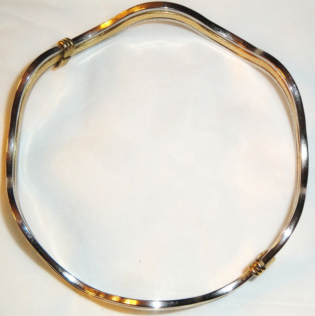 Vintage Signed Avon "Fashion Waves" Bracelet ~ 2 silver-tone bands bordering a band of gold-tone creating an interlocking scalloped bangle Vintage Signed Avon "Fashion Waves" Bracelet ~ 2 silver-tone bands bordering a band of gold-tone creating an interlocking scalloped bangle