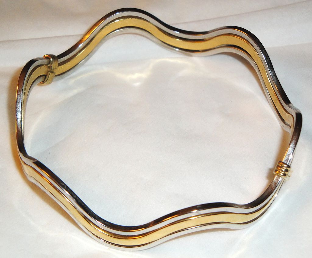 Vintage Signed Avon "Fashion Waves" Bracelet ~ 2 silver-tone bands bordering a band of gold-tone creating an interlocking scalloped bangle Vintage Signed Avon "Fashion Waves" Bracelet ~ 2 silver-tone bands bordering a band of gold-tone creating an interlocking scalloped bangle