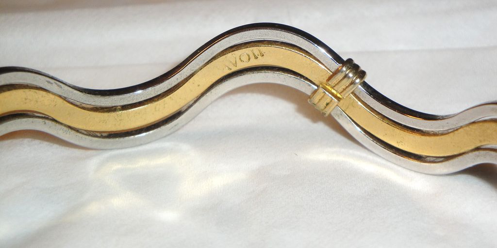 Vintage Signed Avon "Fashion Waves" Bracelet ~ 2 silver-tone bands bordering a band of gold-tone creating an interlocking scalloped bangle Vintage Signed Avon "Fashion Waves" Bracelet ~ 2 silver-tone bands bordering a band of gold-tone creating an interlocking scalloped bangle