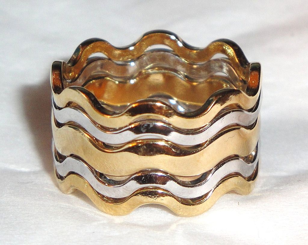 Vintage Signed Avon "Fashion Waves" Bracelet ~ 2 silver-tone bands bordering a band of gold-tone creating an interlocking scalloped bangle Vintage Signed Avon "Fashion Waves" Bracelet ~ 2 silver-tone bands bordering a band of gold-tone creating an interlocking scalloped bangle