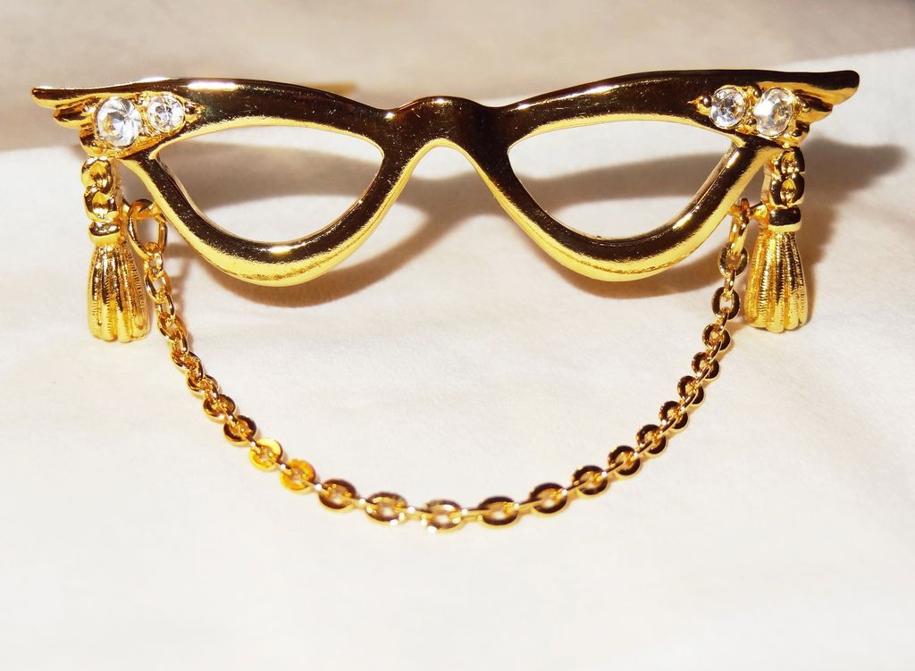 Avon's 1994 "Golden Eyeglass Holder Pin" ~ Hold glasses when not in use Avon's 1994 "Golden Eyeglass Holder Pin" ~ Hold glasses when not in use