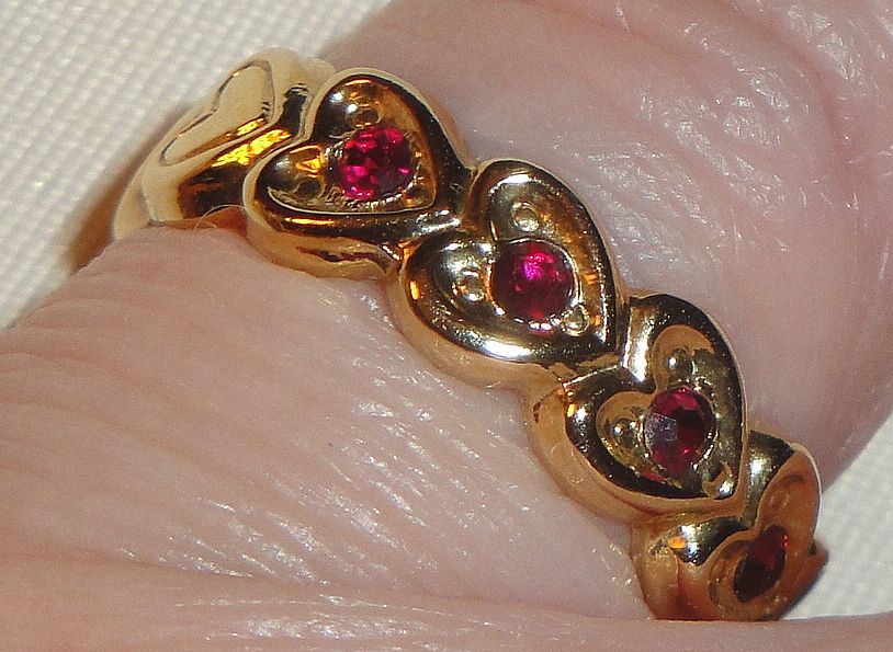 Signed Avon 1992 "Heart to Heart Band" Ring ~ Size 6-7 ~ heart touching heart around the band with 5 garnet colored centers Signed Avon 1992 "Heart to Heart Band" Ring ~ Size 6-7 ~ heart touching heart around the band with 5 garnet colored centers