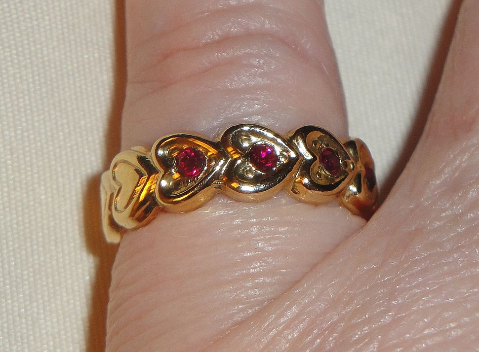 Signed Avon 1992 "Heart to Heart Band" Ring ~ Size 6-7 ~ heart touching heart around the band with 5 garnet colored centers Signed Avon 1992 "Heart to Heart Band" Ring ~ Size 6-7 ~ heart touching heart around the band with 5 garnet colored centers