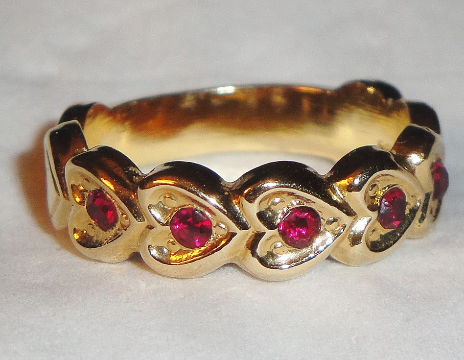 Signed Avon 1992 "Heart to Heart Band" Ring ~ Size 6-7 ~ heart touching heart around the band with 5 garnet colored centers Signed Avon 1992 "Heart to Heart Band" Ring ~ Size 6-7 ~ heart touching heart around the band with 5 garnet colored centers
