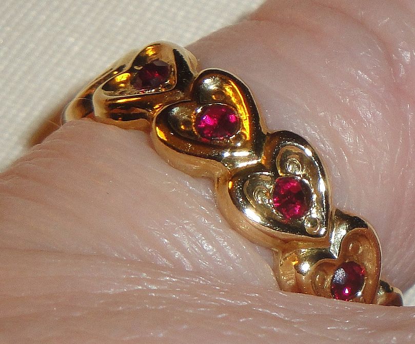 Signed Avon 1992 "Heart to Heart Band" Ring ~ Size 6-7 ~ heart touching heart around the band with 5 garnet colored centers Signed Avon 1992 "Heart to Heart Band" Ring ~ Size 6-7 ~ heart touching heart around the band with 5 garnet colored centers