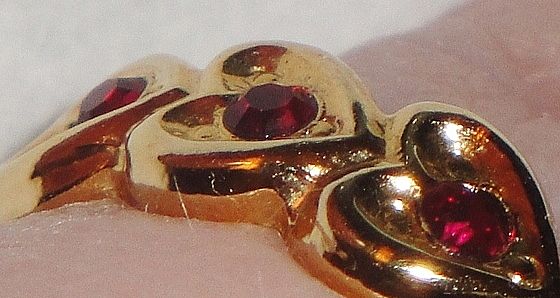 Signed Avon 1992 "Heart to Heart Band" Ring ~ Size 6-7 ~ heart touching heart around the band with 5 garnet colored centers Signed Avon 1992 "Heart to Heart Band" Ring ~ Size 6-7 ~ heart touching heart around the band with 5 garnet colored centers