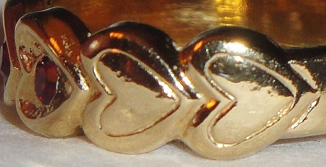 Signed Avon 1992 "Heart to Heart Band" Ring ~ Size 6-7 ~ heart touching heart around the band with 5 garnet colored centers Signed Avon 1992 "Heart to Heart Band" Ring ~ Size 6-7 ~ heart touching heart around the band with 5 garnet colored centers