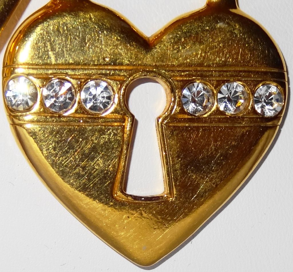 Avon's 1993 "Unlock My Heart Necklace" ~ gold-tone heart and key on black cord Avon's 1993 "Unlock My Heart Necklace" ~ gold-tone heart and key on black cord