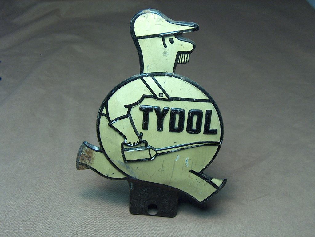 1930s "Tydol" Tin Litho License Topper. 1930s "Tydol" Tin Litho License Topper.