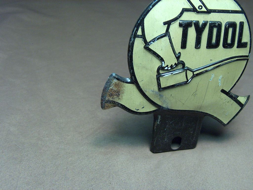 1930s "Tydol" Tin Litho License Topper. 1930s "Tydol" Tin Litho License Topper.