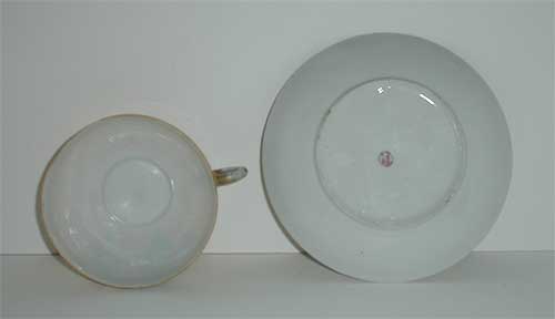 Painted Porcelain lustre geisha cup and saucer Painted Porcelain lustre geisha cup and saucer