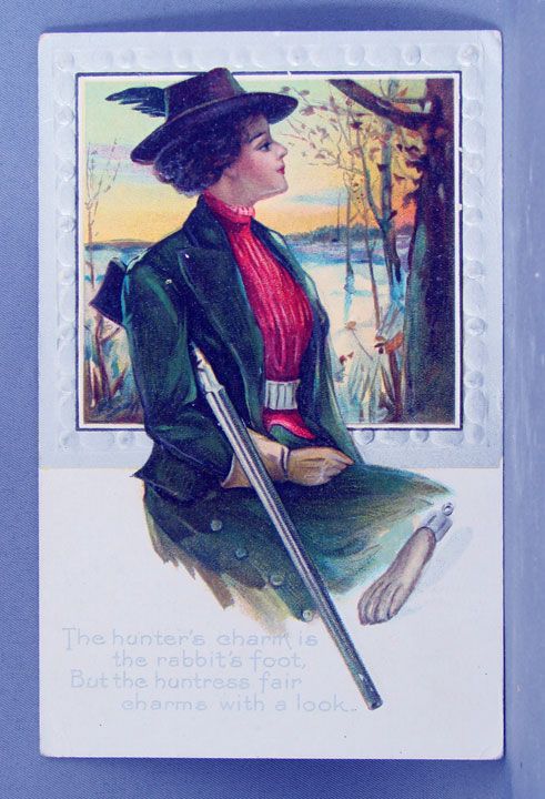 1910 Huntress with rifle and rabbit's foot 1910 Huntress with rifle and rabbit's foot