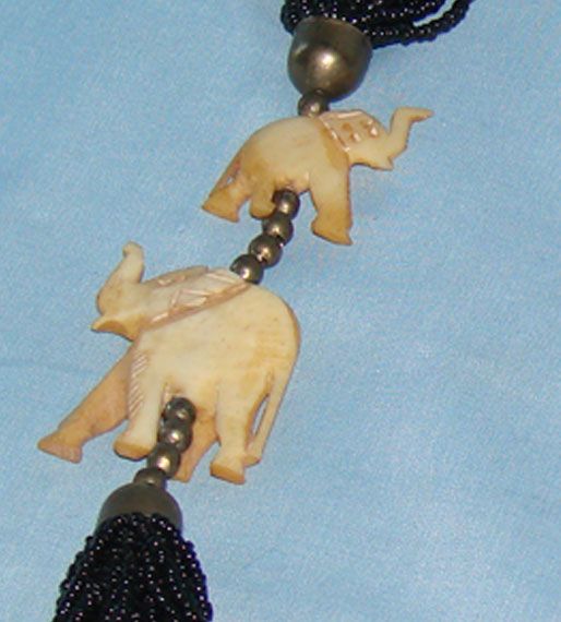 Vintage multi-stranded black seed bead necklace with bone elephants Vintage multi-stranded black seed bead necklace with bone elephants