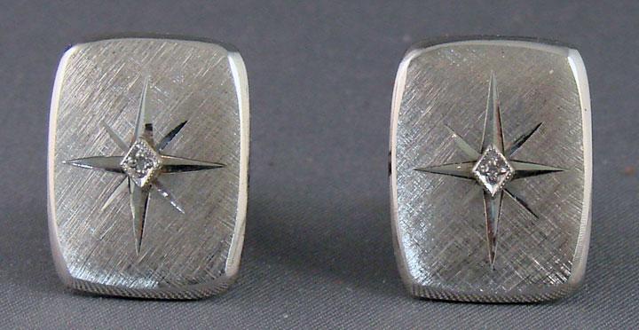 Silver Tone Cuff Links with Clear Stones in a Star Setting. Silver Tone Cuff Links with Clear Stones in a Star Setting.