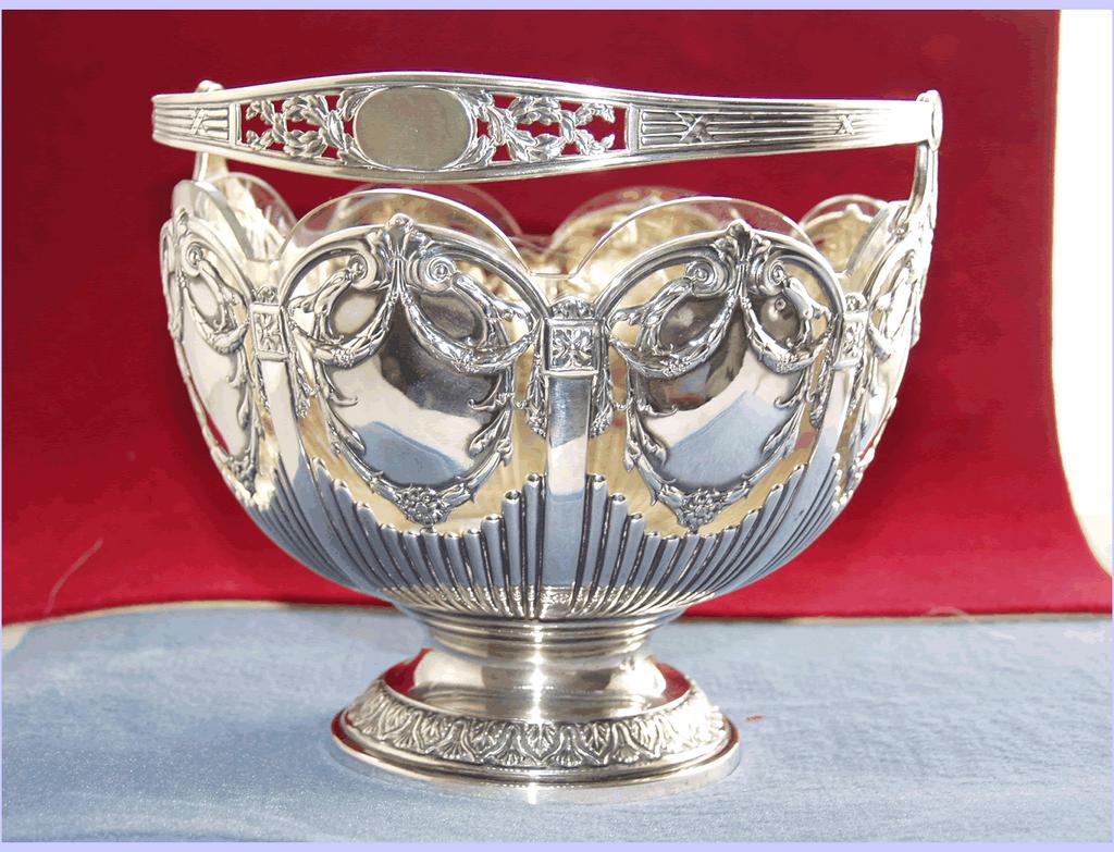 Austrian19th century silver bowl with swing handle and rich scrolling foliage decoration Austrian19th century silver bowl with swing handle and rich scrolling foliage decoration
