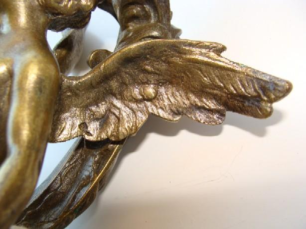 19th century brass figure of a Cupid 19th century brass figure of a Cupid