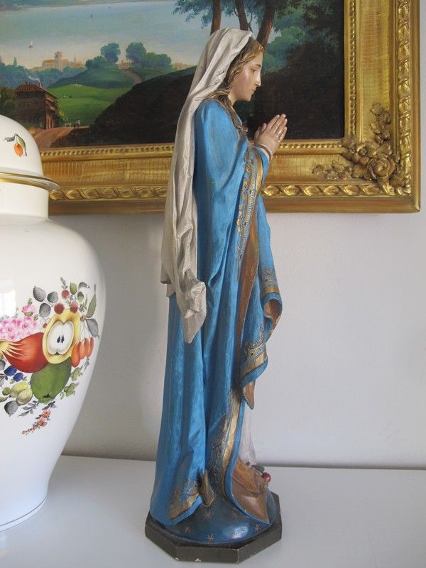 A polychrome carved lime wood figure of the Holy Virgin standing on the crescent moon, South Tyrol end of the 19th century. A polychrome carved lime wood figure of the Holy Virgin standing on the crescent moon, South Tyrol end of the 19th century.