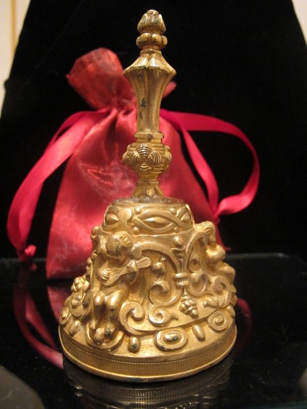 Bronze dinner bell with c-scrolls and three little Cherubs, turn of the 20th century Bronze dinner bell with c-scrolls and three little Cherubs, turn of the 20th century