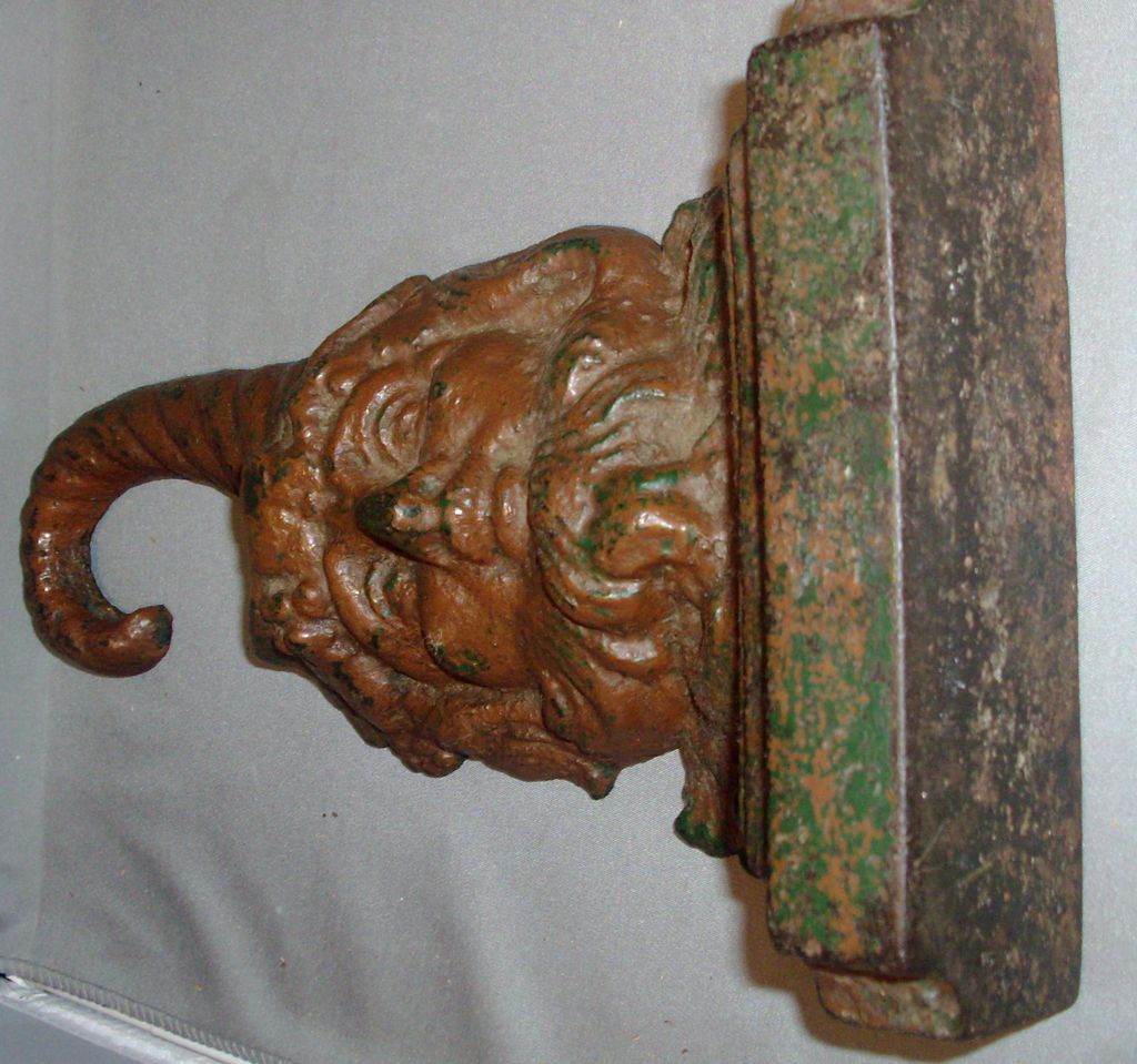19th century Cast Iron Figural Door Stop Bacchus with Cornucopia Handle 19th century Cast Iron Figural Door Stop Bacchus with Cornucopia Handle