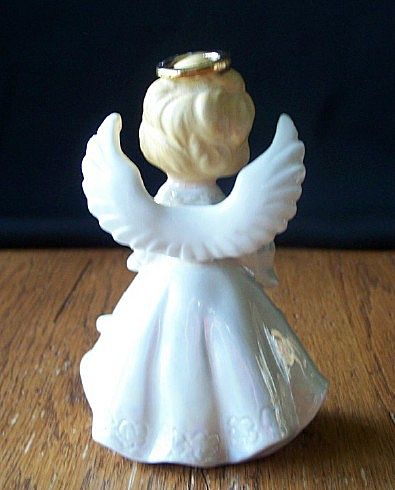 June Angel Holding Wedding Rings Figurines June Angel Holding Wedding Rings Figurines