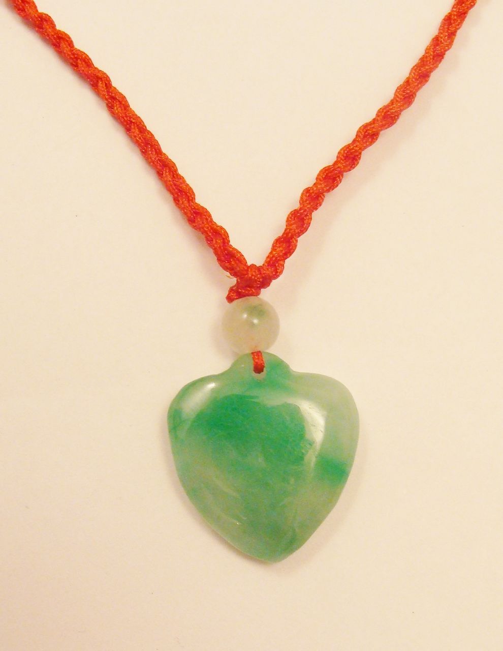 Delightful Carved Green Jade Heart & Bead on Red Satin Cord Necklace Delightful Carved Green Jade Heart & Bead on Red Satin Cord Necklace