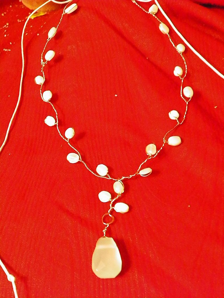 Twisted Copper Wire with Opal Beads as Flowers and Faceted Chalcedony as the Centerpiece Twisted Copper Wire with Opal Beads as Flowers and Faceted Chalcedony as the Centerpiece