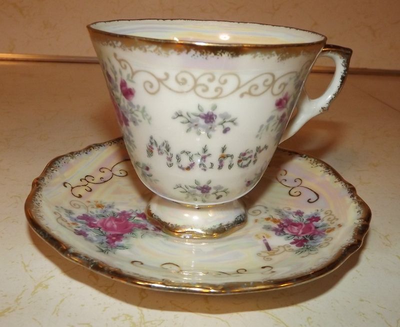 Iridescent Mother teacup and saucer with Enesco Imports foil Japan label Iridescent Mother teacup and saucer with Enesco Imports foil Japan label