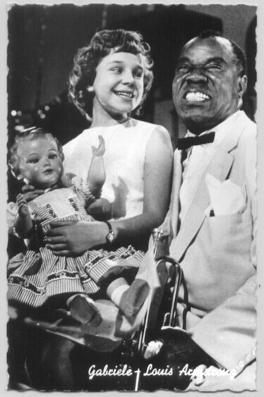 Louis Satchmo Armstrong and Gabriele, holding a big doll. Louis Satchmo Armstrong and Gabriele, holding a big doll.