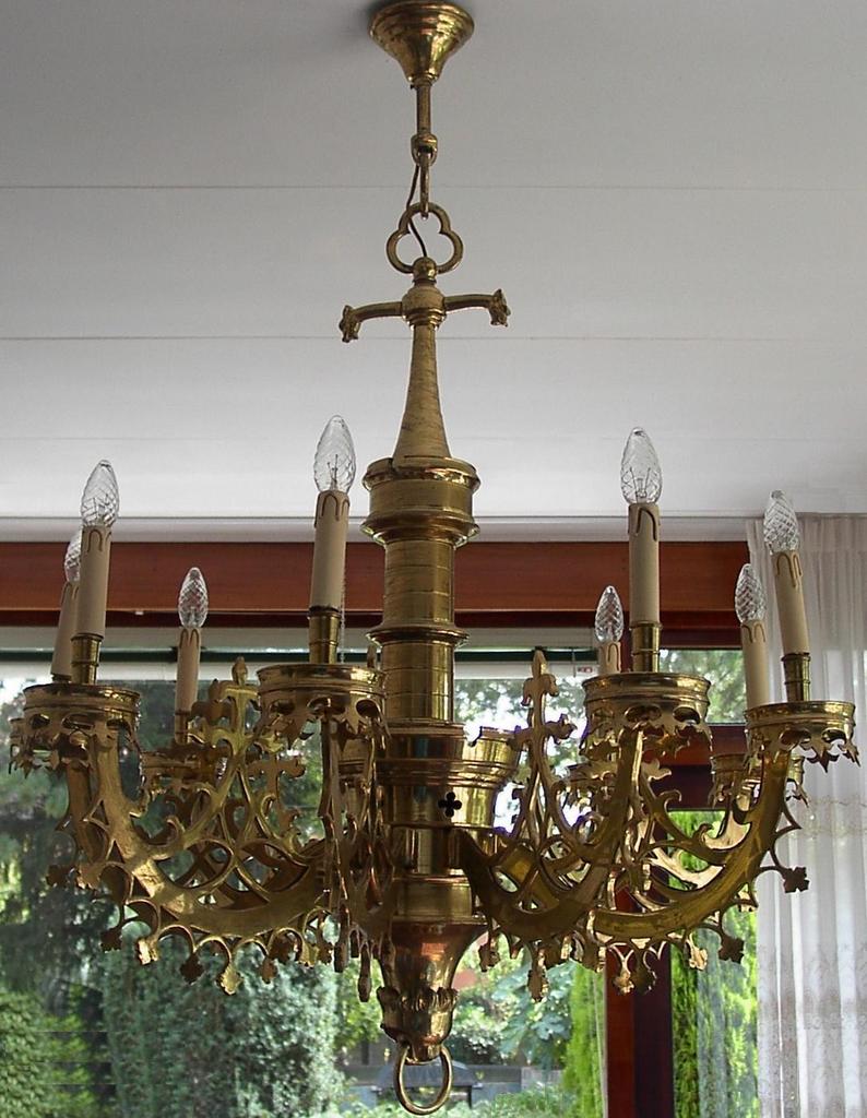 An Old Exclusive Brass Gothic Art 9-light Chandelier An Old Exclusive Brass Gothic Art 9-light Chandelier