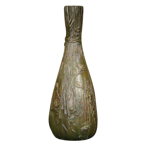 Antique bronze detailed vase with flowers and reeds Antique bronze detailed vase with flowers and reeds